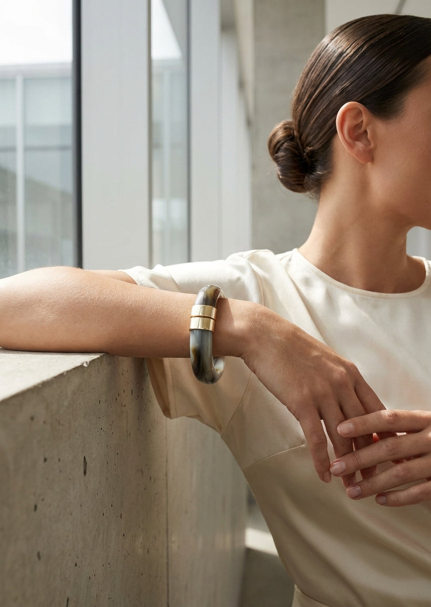 Envy Chunky grey resin bracelet with gold‑tone accents with a spring hinged opening
