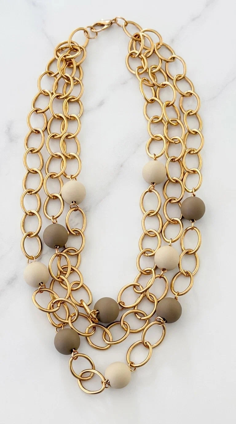 Short Triple Gold Link Necklace with Taupe & Cream Resin Ball Detail