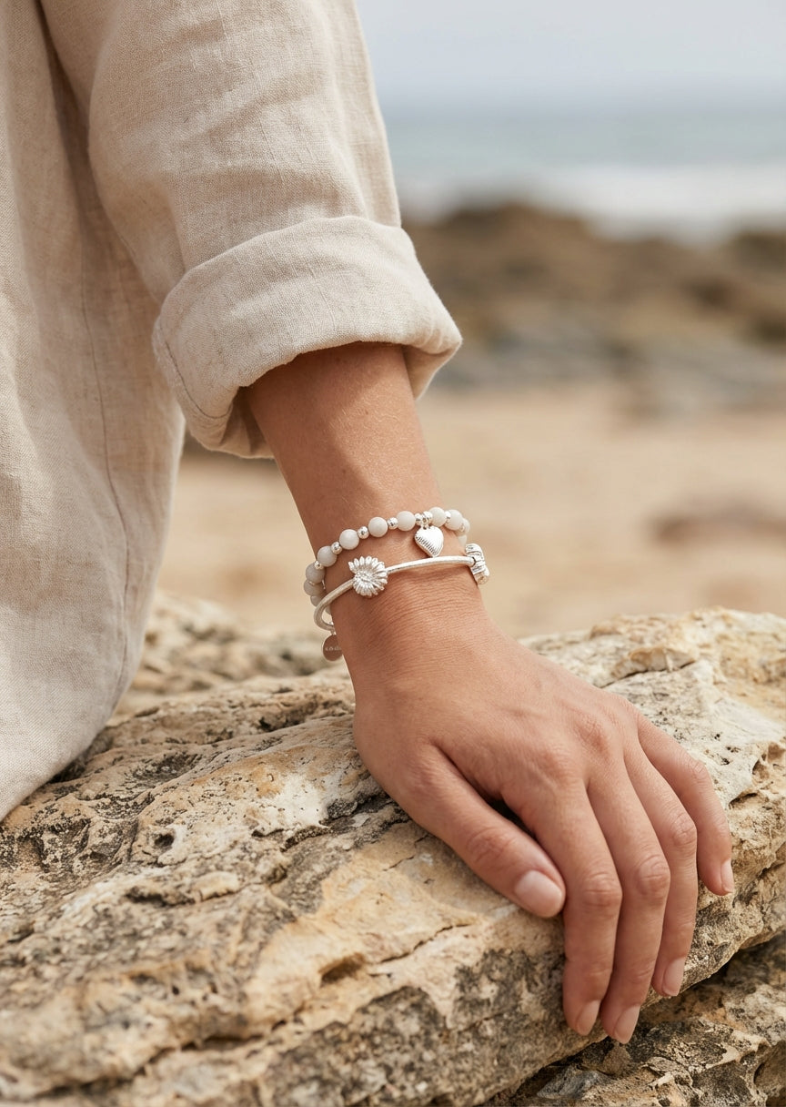 Envy Silver charm‑stack bracelet with silver shells and white pearl beads
