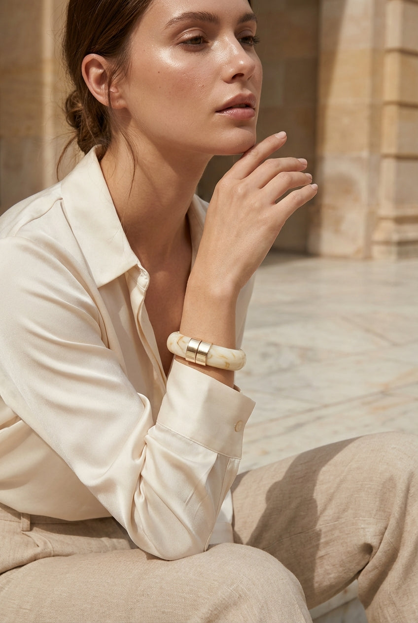 Envy Chunky cream resin bracelet with gold‑tone accents with a spring hinged opening