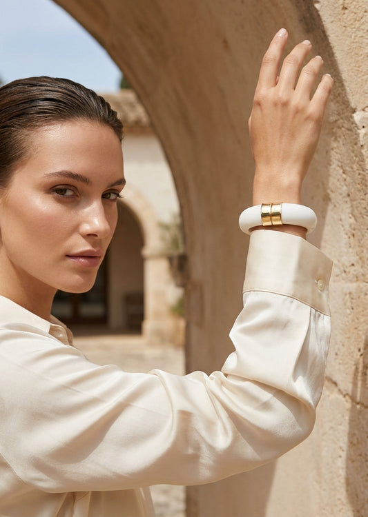 Envy Chunky white resin bracelet with gold‑tone accents with a spring hinged opening