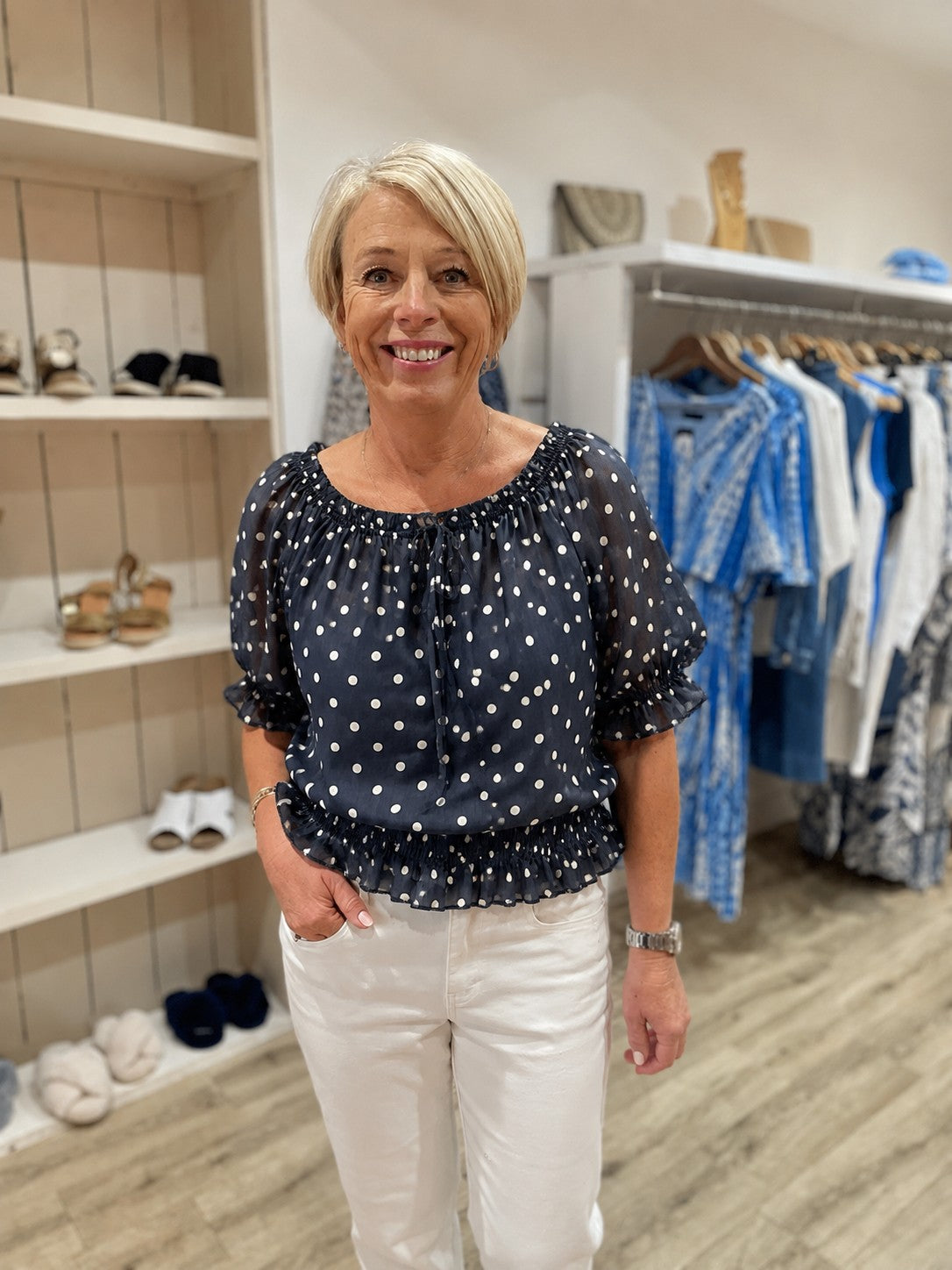 Navy and white polka dot top