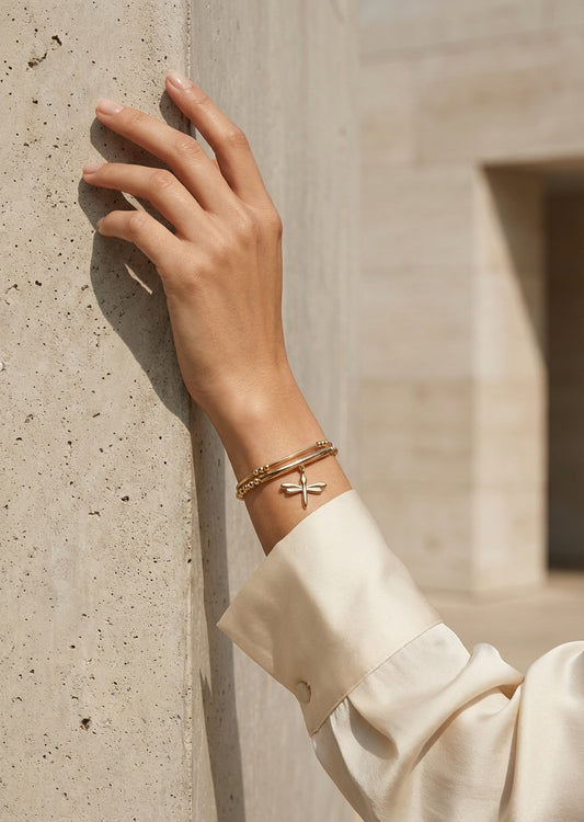 Envy Gold multi‑strand bracelet with a delicate dragonfly charm