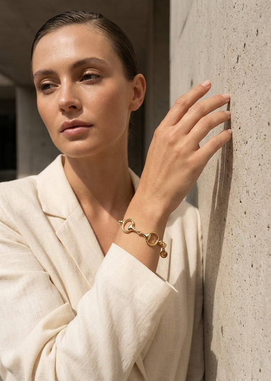 Envy Gold bead bracelet with a gold horse-bit clasp